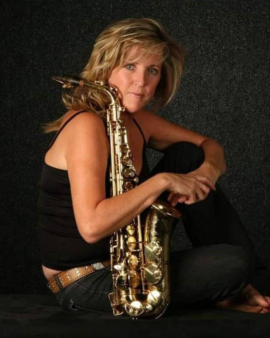 Professional portrait of Debi Best, a master saxophonist in South Africa.