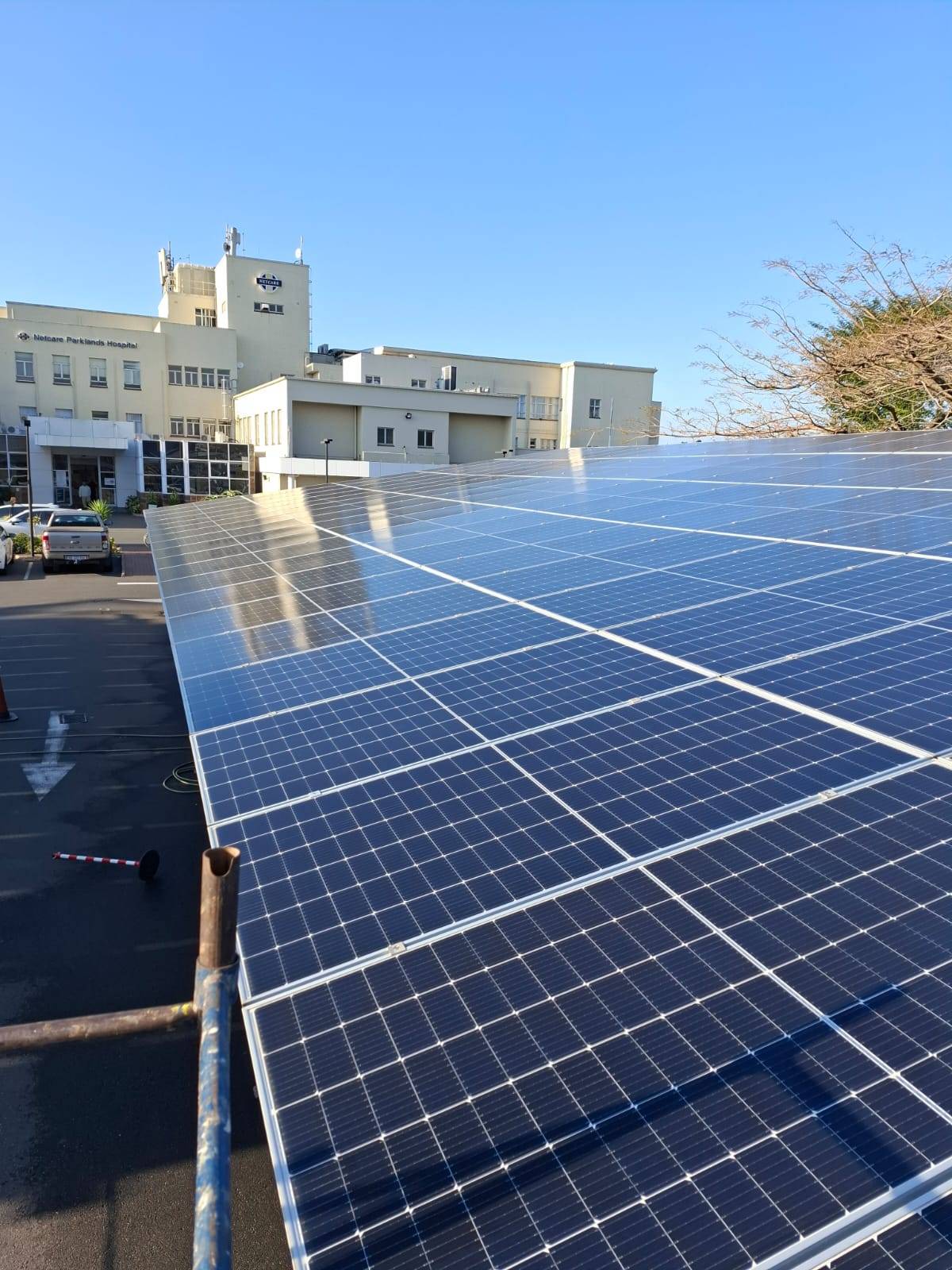 Solar panels on a business building roof serviced by ECIS cleaning services in Durban.